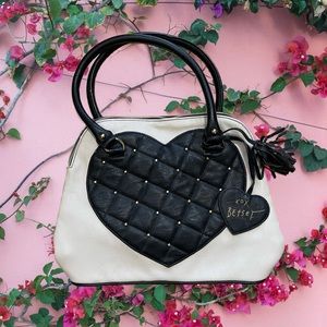 Black and white-cream Bestsey Johnson purse.